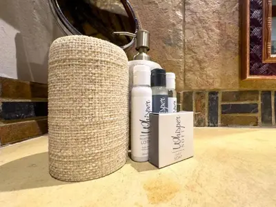 two bottles ofodorizers sitting on top of a table at Kanaan, Mabalingwe in Mabula