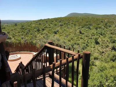 a person taking a picture of the view from a deck at Kanaan, Mabalingwe in Mabula