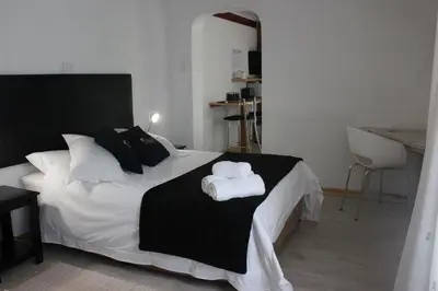 a bedroom with a bed with two towels on it at Francor Guesthouse in Pretoria