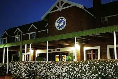 a building with a clock on the side of it at Pietersburg Club in Polokwane