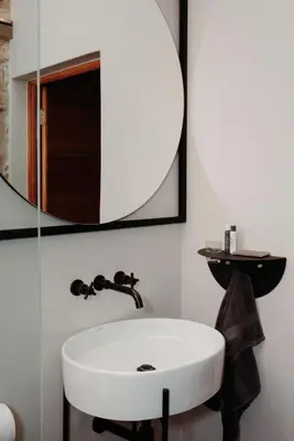 a bathroom with a white sink and a mirror at Bastion House in Irene