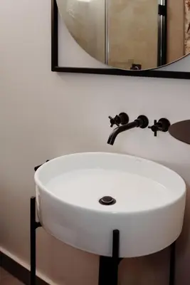 a white sink in a bathroom with a mirror at Bastion House in Irene