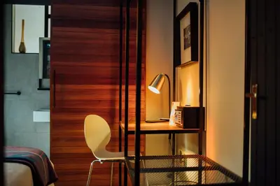 a bedroom with a desk and a chair next to a bed at Bastion House in Irene