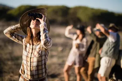 a woman taking a picture of a group of people at Zwahili Private Game Lodge & Spa in Modimolle