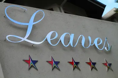 a sign that says dance on a wall with stars at Indalo Leaves Lodge and Spa in Nelspruit