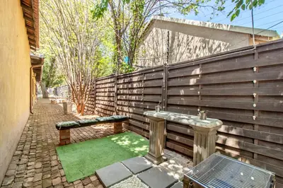 a garden with a bench and a green lawn at Villa Roma - Luxury Accommodation in Centurion