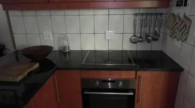 a kitchen with a sink and a counter top at Peace@Kruger in Marloth Park