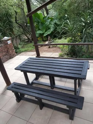a blue bench sitting on top of a swing at Peace@Kruger in Marloth Park