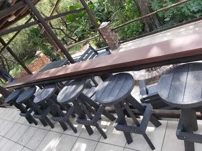 a group of chairs sitting under a picnic table at Peace@Kruger in Marloth Park