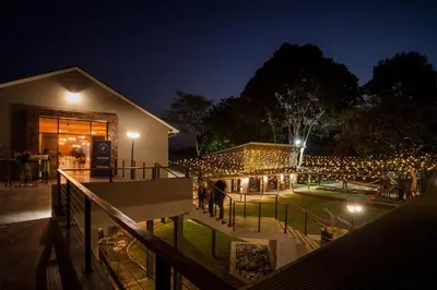 a building with lights on it at night at Letaba Junction Lodge in Letsitele