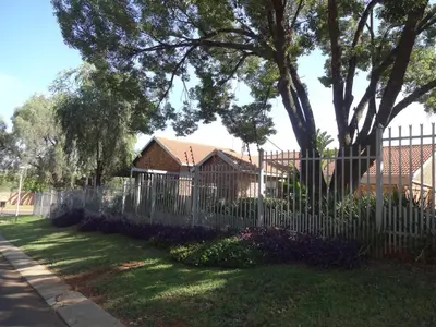 a white picket fence in front of a house at 273 Rhino retreat-solar backup in Centurion