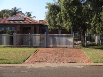 a fence in front of a house with a house at 273 Rhino retreat-solar backup in Centurion
