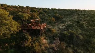 a observation deck on the side of a hill at Dinkweng Safari Lodge in The Waterberg Biosphere