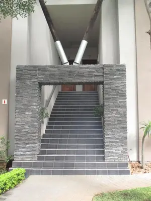 a set of stairs leading up to a building at Ecolux Boutique Hotel in Komatipoort