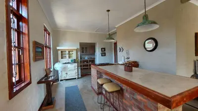 a kitchen with a large island in a room at Bluebell Barn in Dullstroom