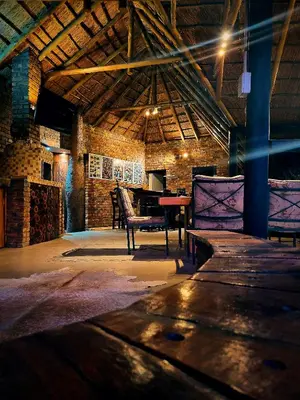 a room with a table and chairs in a building at Cycad Place Midrand Guesthouse and B&B in Midrand