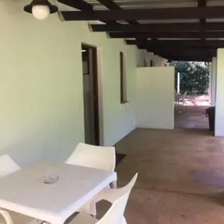 a white table and white chairs in a room at Morgenzon Estate in Pretoria