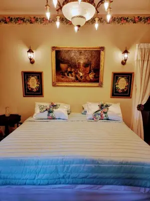 a bedroom with a large bed with two pillows at Mia's in Tzaneen