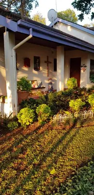 a house with a cross on the side of it at Mia's in Tzaneen