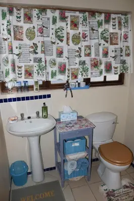 a bathroom with a sink and a toilet at Mia's in Tzaneen