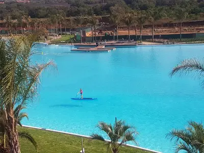 a person in a boat in a large blue lake at The Blyde Lagoon, Pretoria in Pretoria