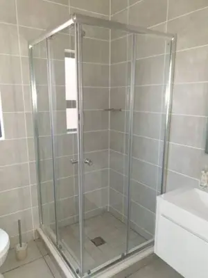 a shower with a glass door in a bathroom at The Blyde Lagoon, Pretoria in Pretoria