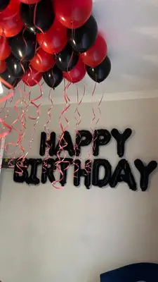 a bunch of balloons hanging from a happy birthday sign at The Blyde Lagoon, Pretoria in Pretoria