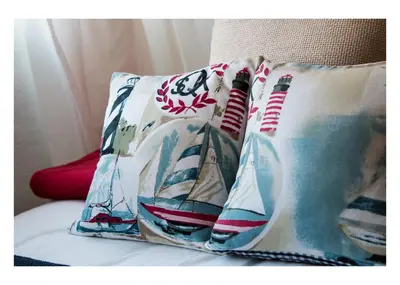 a pillow with boats on it sitting on a bed at Anchor Guesthouse in Secunda