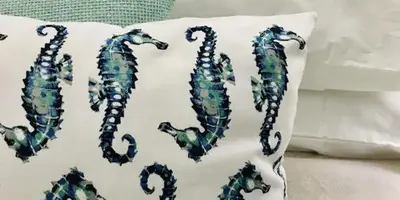 a pillow with the word seahorses on it at Anchor Guesthouse in Secunda
