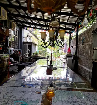 a glass table with a chandelier on top of it at Eagle's Nest in Barberton