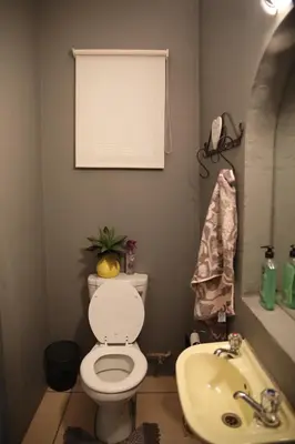 a bathroom with a toilet and a sink at Eagle's Nest in Barberton