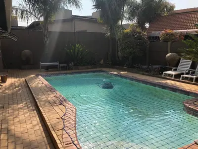 a swimming pool with a turtle in the water at Annies Place Self Catering in Kempton Park
