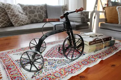 a statue of a bike on a table in a living room at @Home in the East in Pretoria