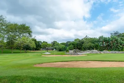 a view of a golf course with a green at Kruger Park Lodge Unit No. 239 in Hazyview