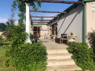 a porch of a house with stairs leading to it at Apple and Rose in Belfast