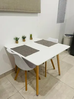 a white table and two chairs in a room at Sweet Home Alibama in Nelspruit