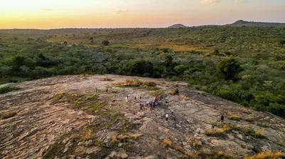 a group of people standing on top of a rock at Mdluli Safari Lodge in Hazyview