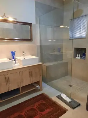 a bathroom with a sink and a shower at 64 on Malabor in Pretoria