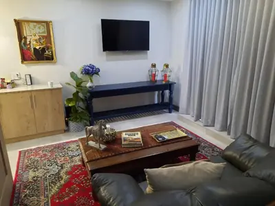 a living room with a couch and a table at 64 on Malabor in Pretoria