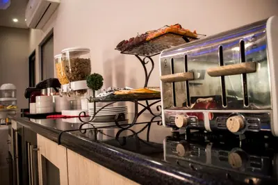 a kitchen with a toaster oven on a counter at Aqua Stone guest house in Nelspruit