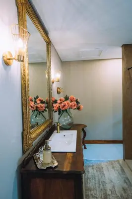 a bathroom with a sink and a mirror at The Bohemian Guesthouse in Tzaneen