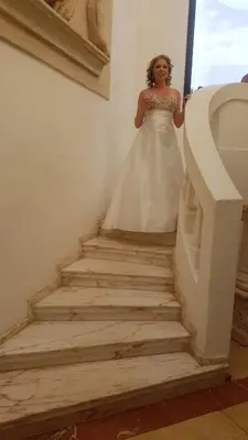 a woman in a wedding dress walking down stairs at Kleineweide Boutique Estate in Pretoria