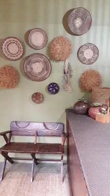 a wall with a bunch of plates on a wall at Echo Caves in Ohrigstad