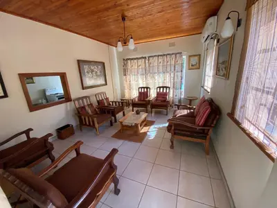 an aerial view of a living room with chairs and a table at Echo Caves in Ohrigstad