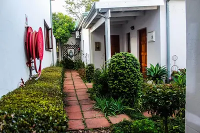 a brick walkway in front of a house at Villa Jana Guesthouse in Pretoria