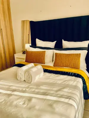 a bedroom with two beds with towels on them at The Blyde, an impeccable blissful getaway (Balwin properties) in Pretoria