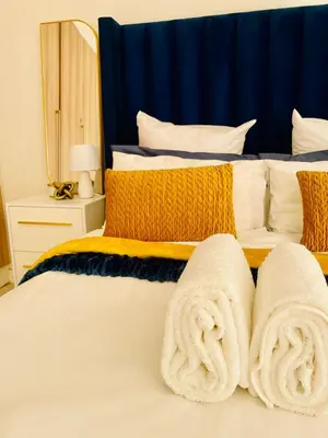a bedroom with two beds with towels on them at The Blyde, an impeccable blissful getaway (Balwin properties) in Pretoria
