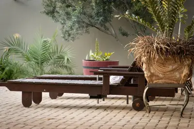 a wooden table with potted plants on top of it at Asuite-Dream in Hoedspruit