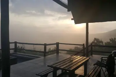 a wooden bench sitting on top of a balcony at Kubu Khaya Mabalingwe in Mabula