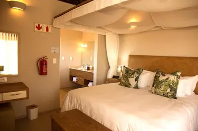 a bedroom with a bed and a loft bed at Jacana River Lodge Mjejane Game Reserve in Hectorspruit